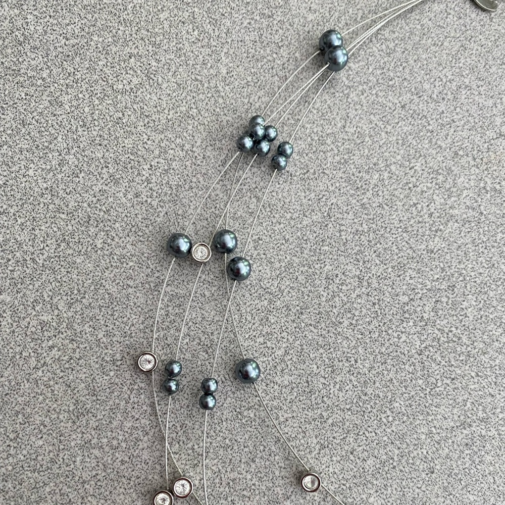 Floating pearl multistrand necklace